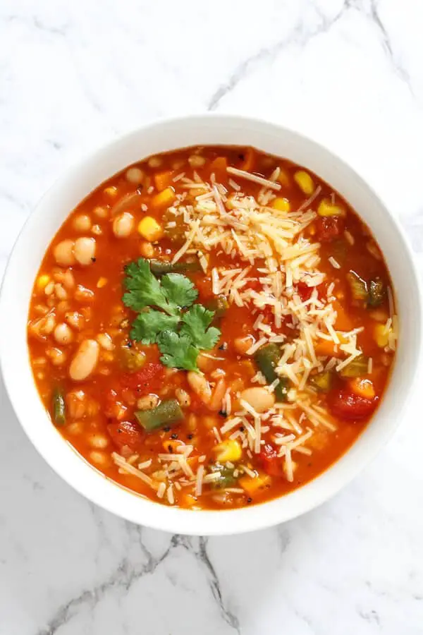 A warm and comforting vegetable barley soup that can be cooked in a pressure cooker, instant pot or stove top.  Made with simple, everyday ingredients and ready in less than an hour whichever method you choose.  