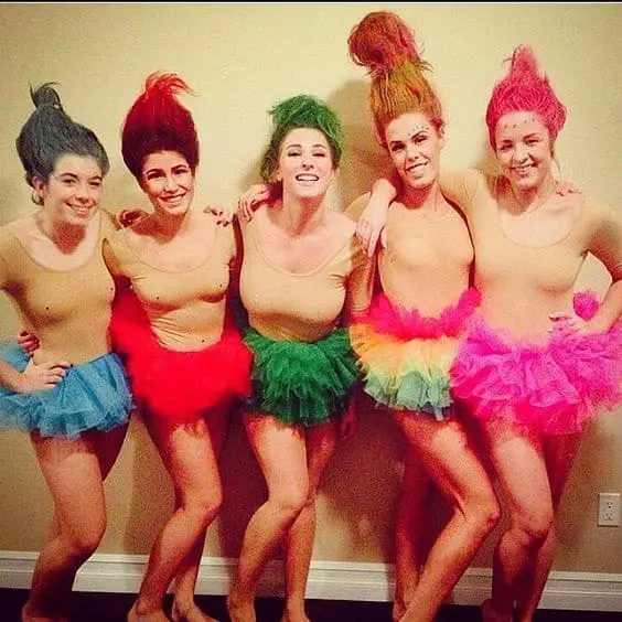 There are so many group costume ideas for the 2020 Halloween season, it's hard to keep up. However, if you're looking to dress in something easy, homemade. Check out this Trolls Halloween Costume look.